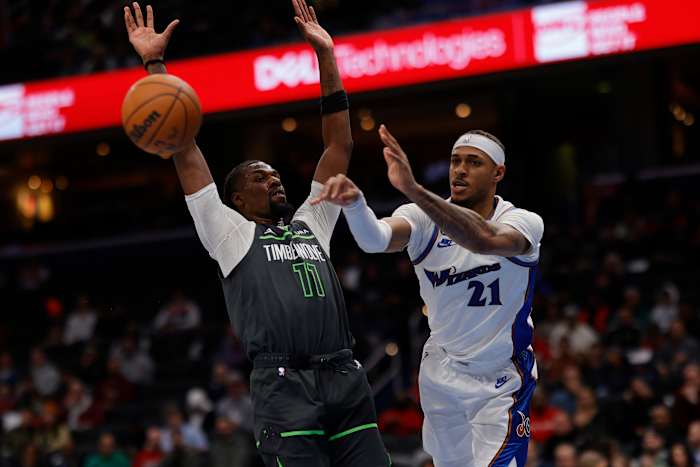 Washington Wizards center Daniel Gafford (21) passes the ball as Minnesota Timberwolves center Naz Reid (11) defends in the fourth quarter at Capital One Arena. Mandatory Credit: Geoff Burke-USA TODAY Sports
